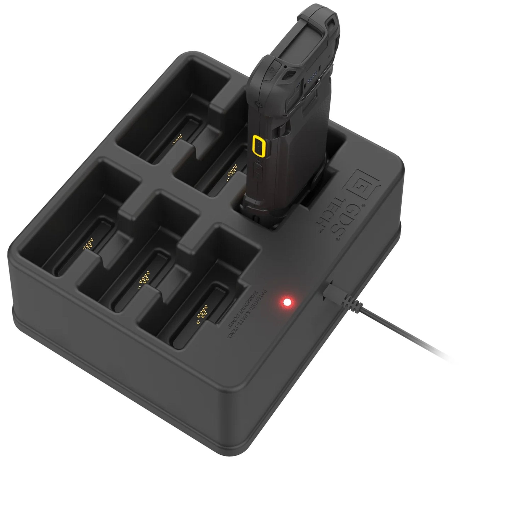 Rugged handheld computer charging in six-bay desktop dock with LED power indicator