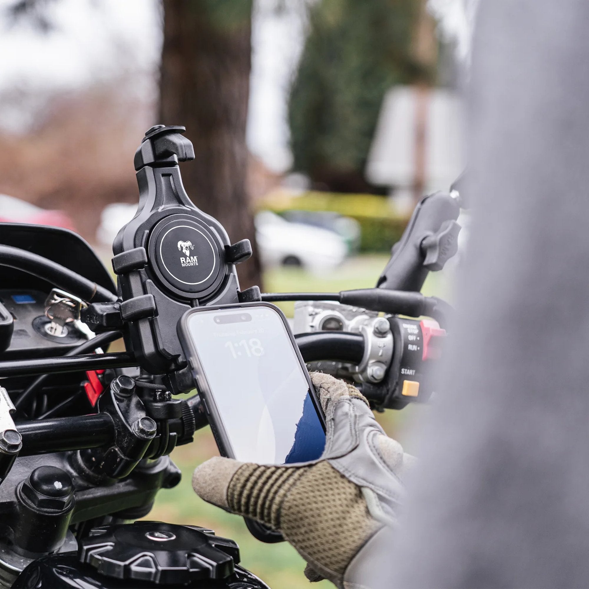 RAM Mounts wireless charging puck installed on motorcycle handlebar phone mount
