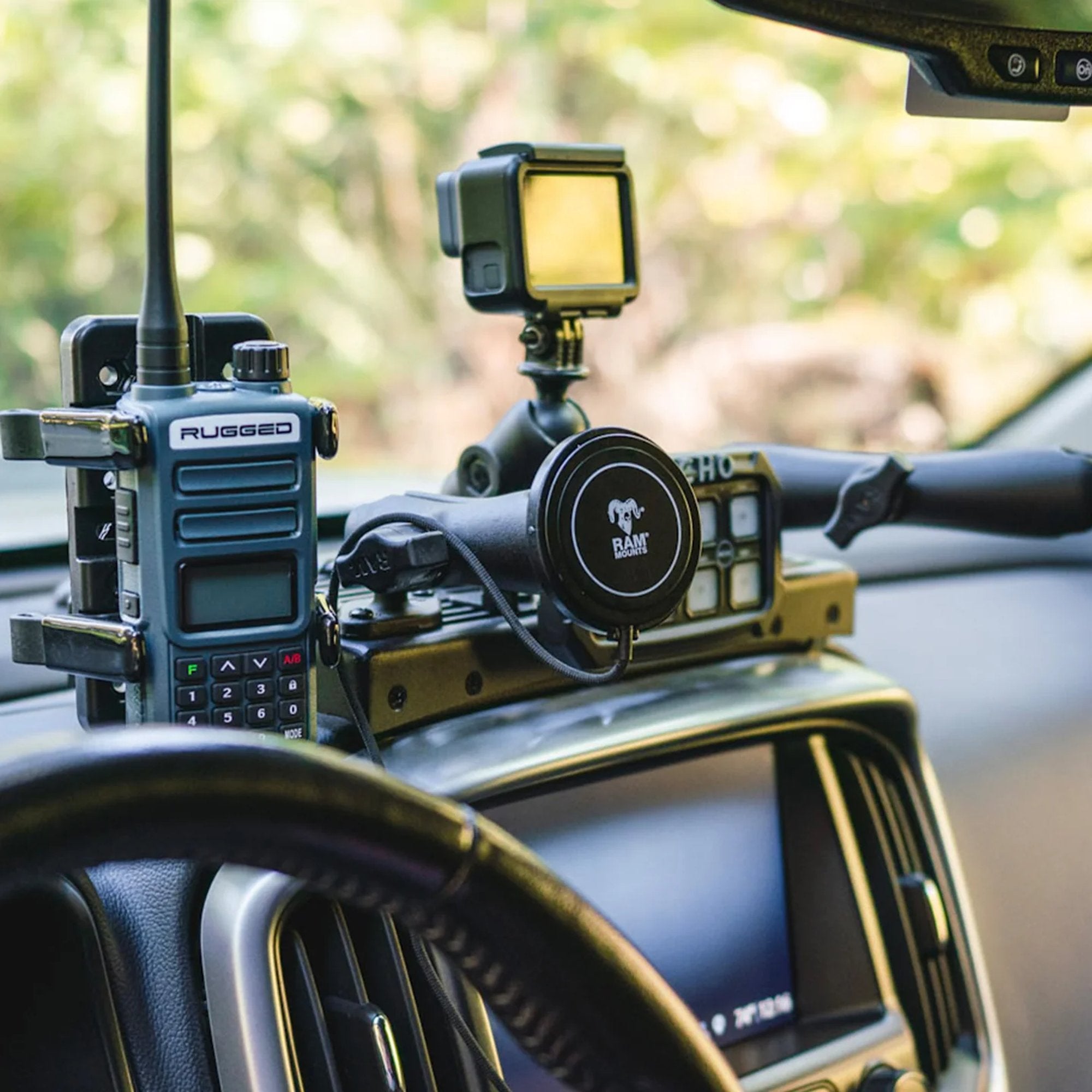 RAM Mounts wireless charger mounted in vehicle dashboard setup with accessories