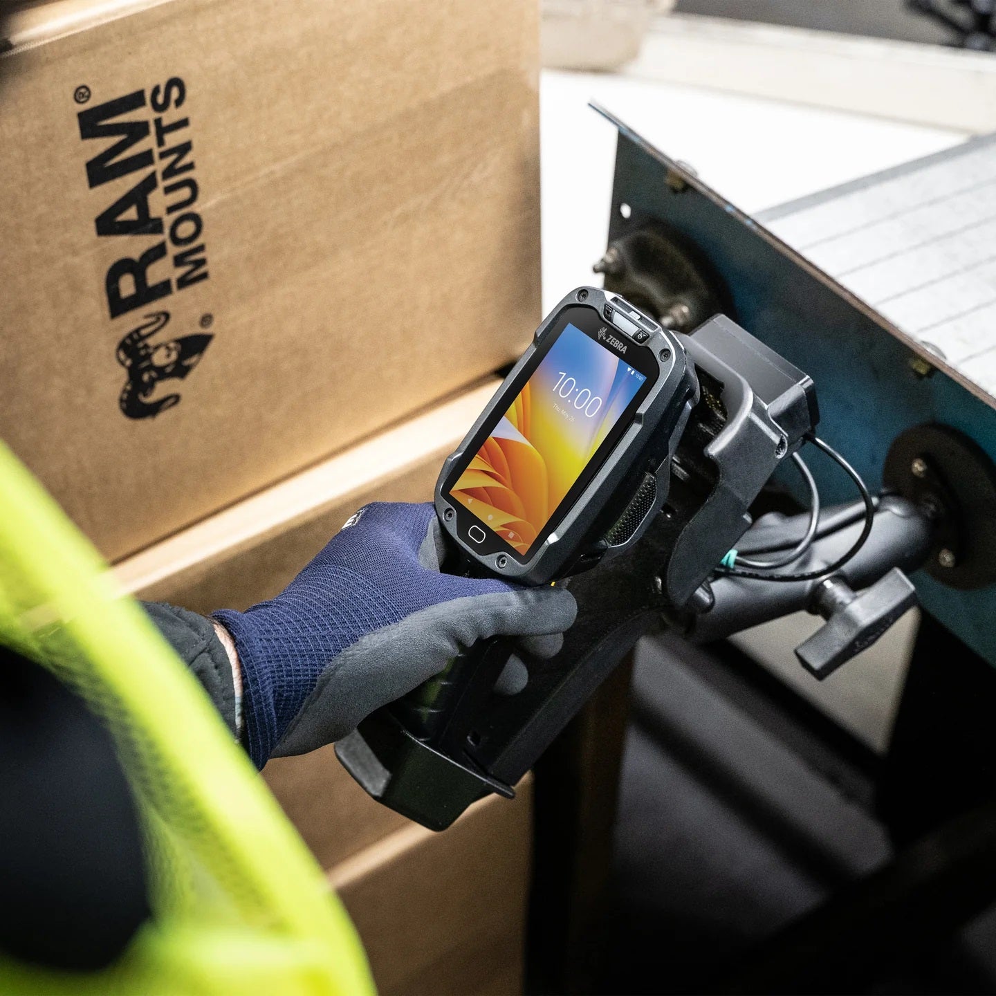 RAM Tough-Mag magnetic mount holding a barcode scanner gun in a warehouse environment