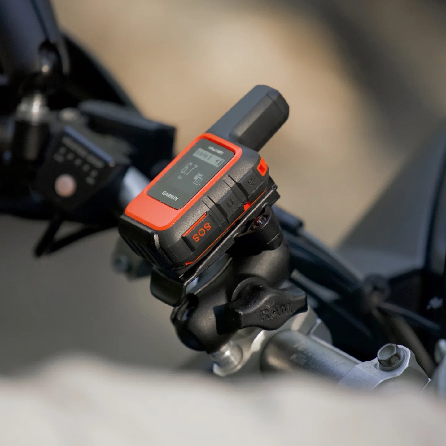 RAM short double socket arm holding a Garmin inReach device on a motorcycle mount